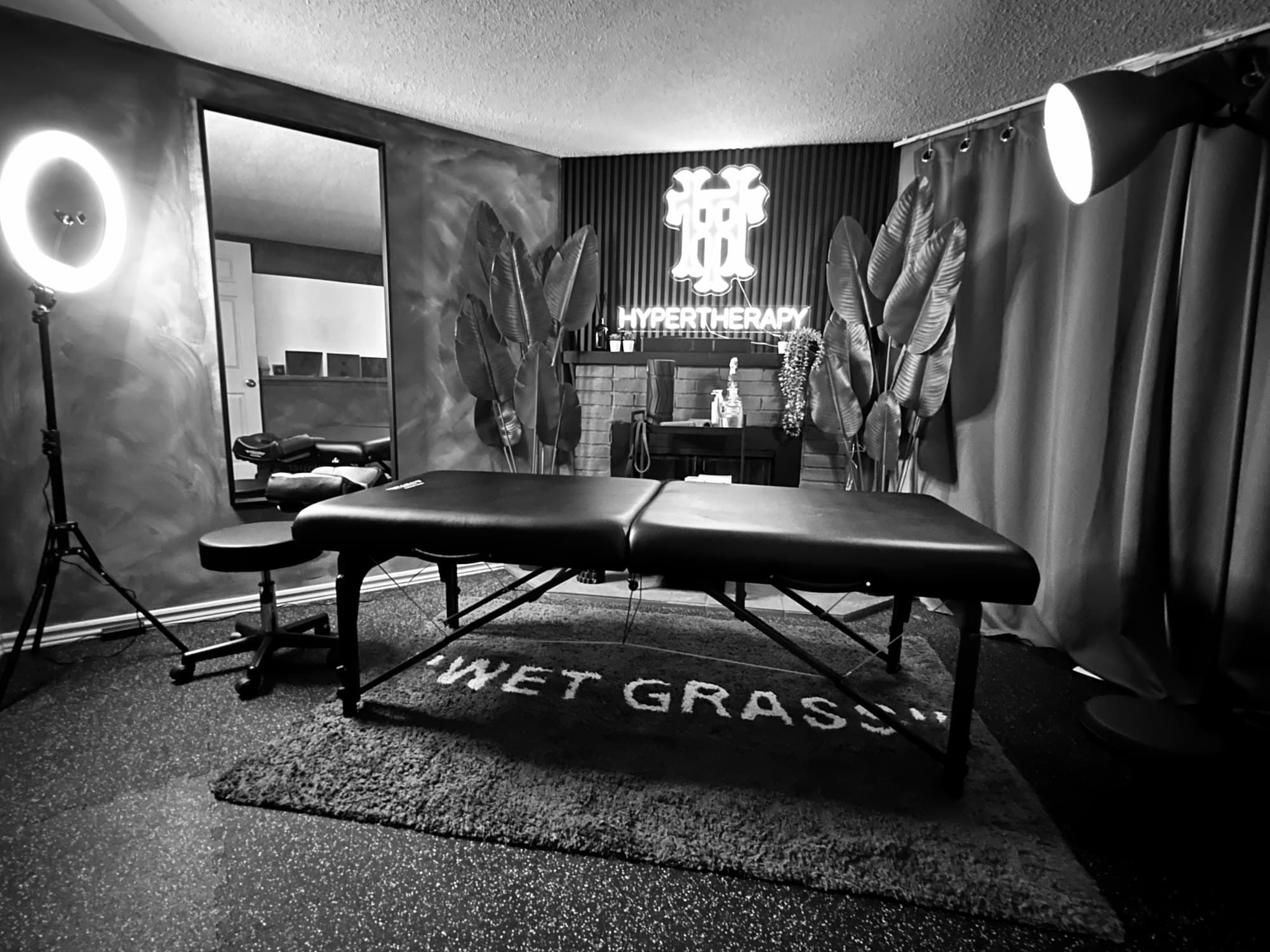 The HyperTherapy branded treatment room with a professional massage table
